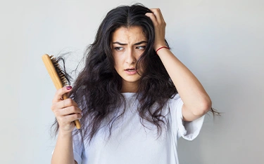 How to stop hair fall and help to regrow